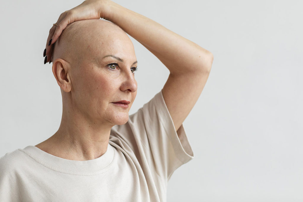 qual a ligacao entre cancer de mama e menopausa